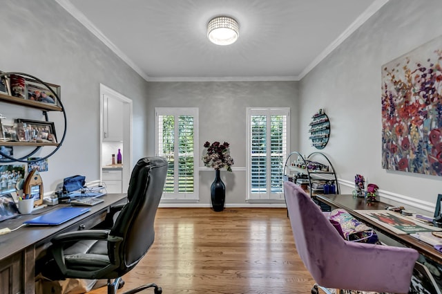 office area featuring ornamental molding and light hardwood / wood-style flooring