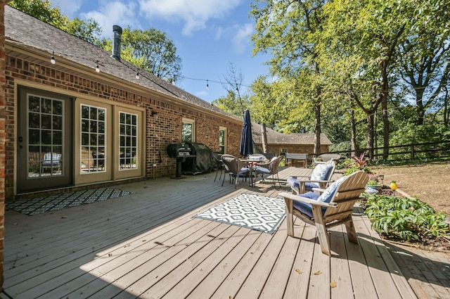 wooden deck featuring grilling area