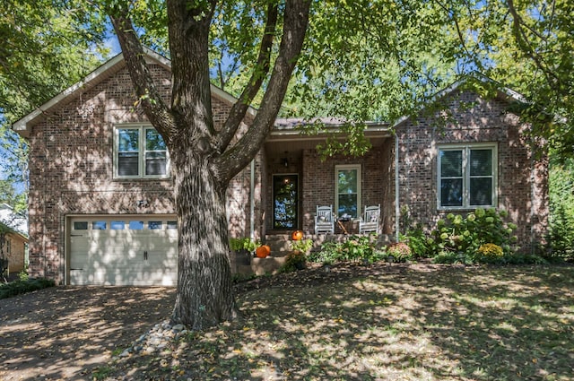 view of front facade with a porch and a garage