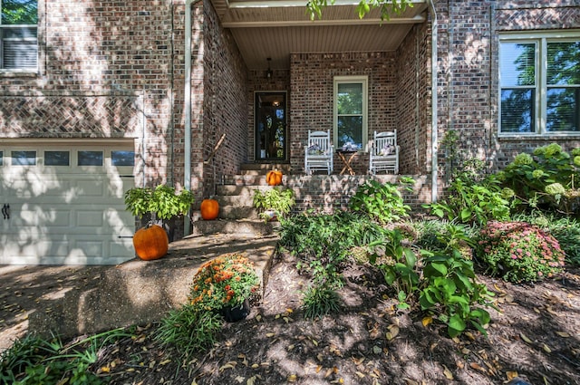 property entrance with a garage and a porch