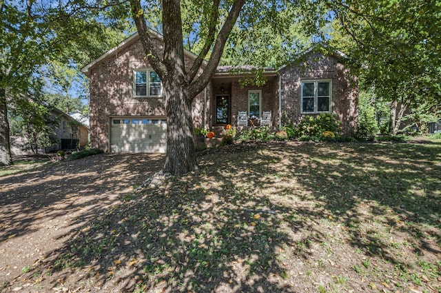 view of front of property featuring a garage and a porch