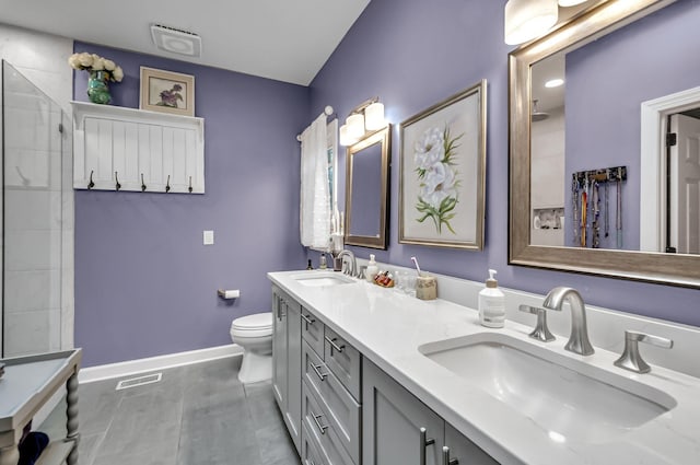 bathroom with a shower, vanity, and toilet