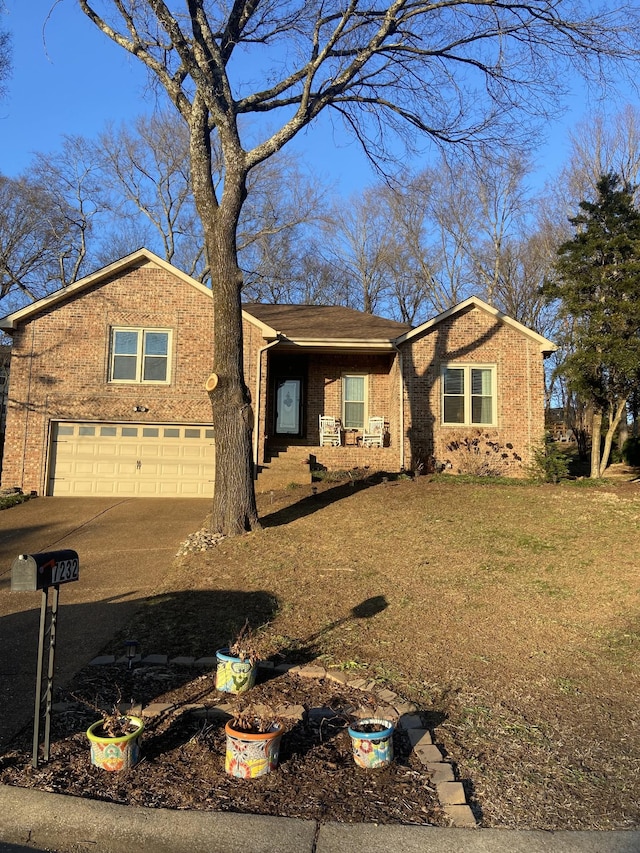 view of front facade with a garage and a front lawn