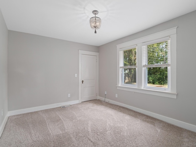 unfurnished room featuring carpet floors