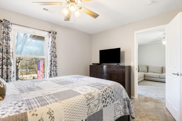 carpeted bedroom with ceiling fan