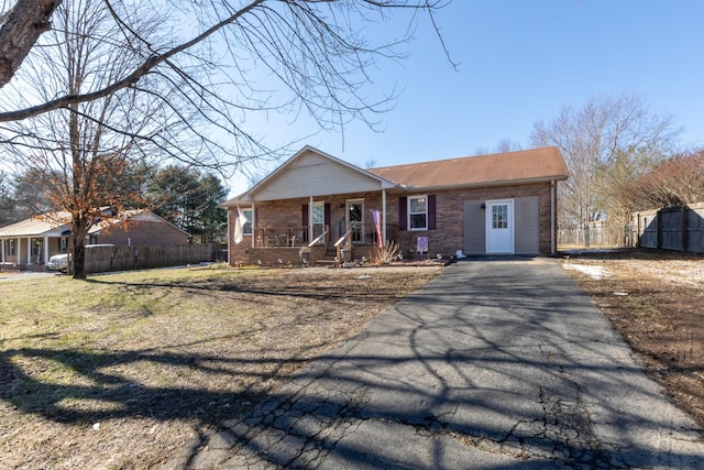 view of front of home with a porch and a front lawn