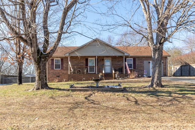 ranch-style home featuring a porch and a front yard