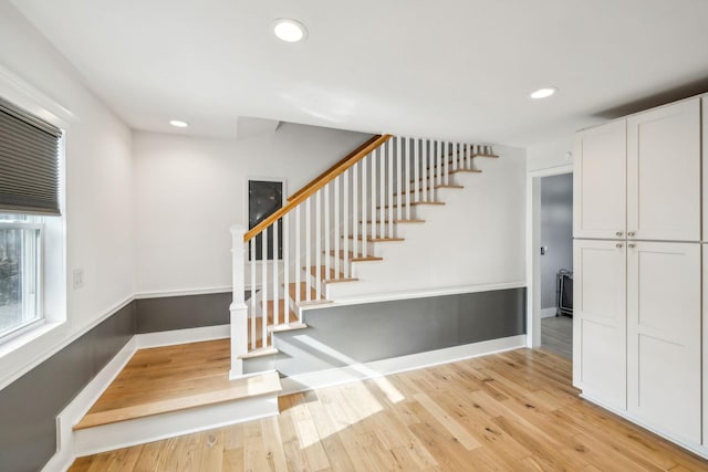 stairs with hardwood / wood-style flooring