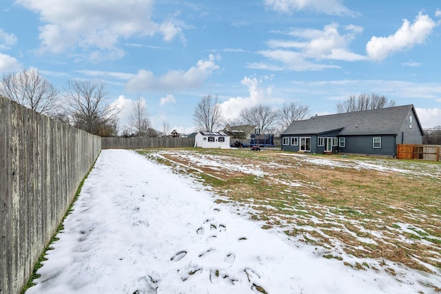 view of yard covered in snow