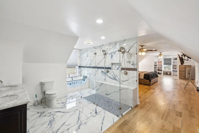 full bathroom with toilet, vanity, ceiling fan, lofted ceiling, and shower with separate bathtub