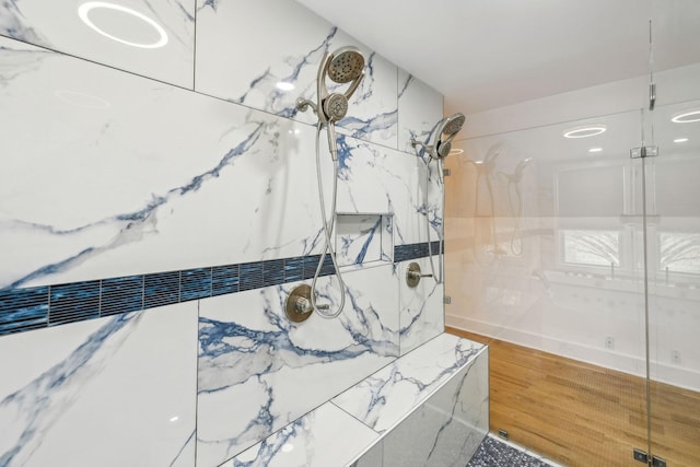 bathroom with walk in shower and hardwood / wood-style flooring