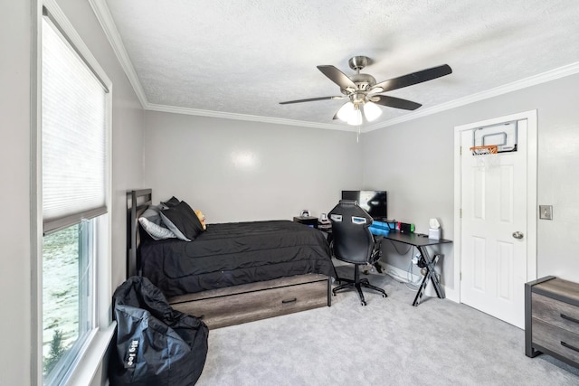 bedroom featuring ceiling fan, light colored carpet, multiple windows, and a textured ceiling