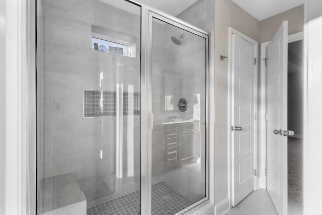 bathroom with tile patterned floors and a shower with shower door