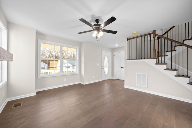 unfurnished living room with ceiling fan and dark hardwood / wood-style floors