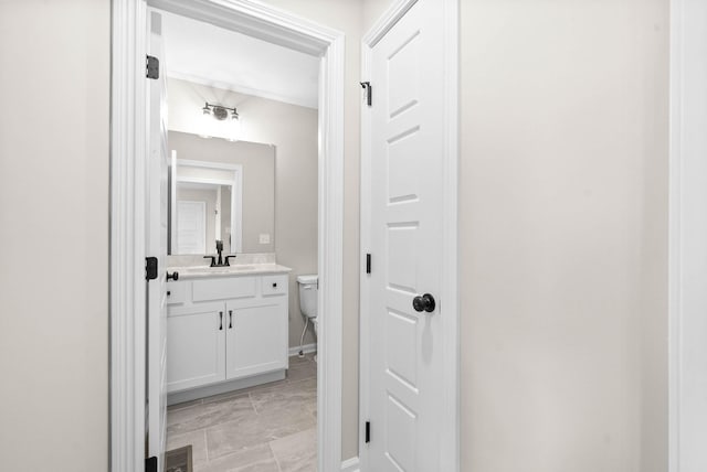 bathroom featuring toilet and vanity