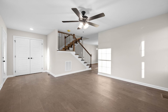 foyer entrance with ceiling fan and dark hardwood / wood-style floors