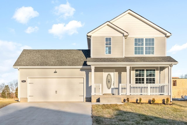 view of front of house with covered porch, a garage, and a front lawn