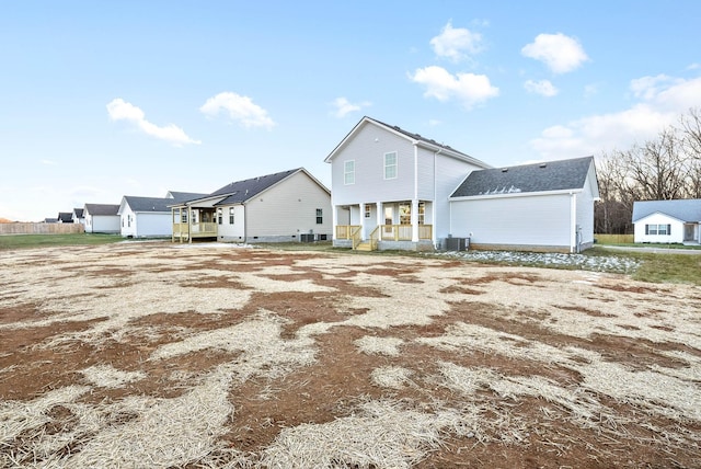 view of front of house featuring central AC unit and a porch