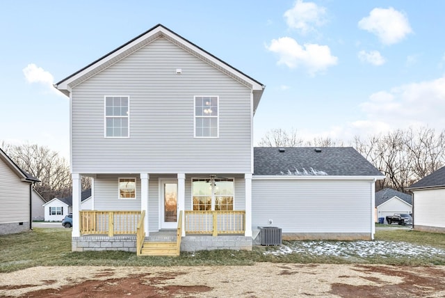 rear view of house featuring a porch