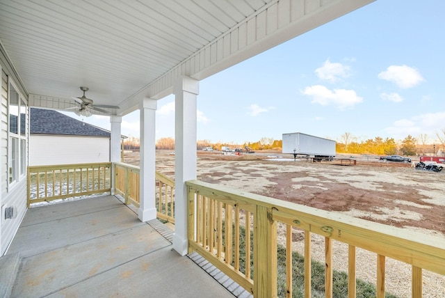 balcony with covered porch and ceiling fan