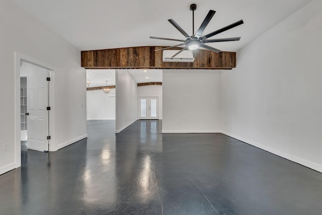 spare room featuring ceiling fan with notable chandelier