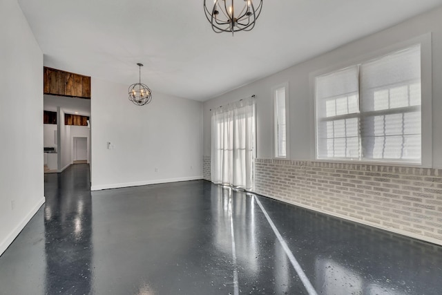 unfurnished dining area with a chandelier