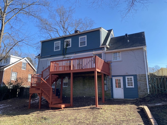 back of house featuring a wooden deck