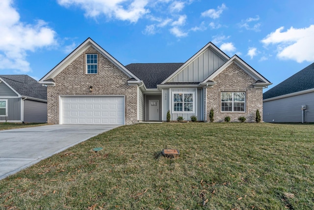 view of front of home with a front yard and a garage