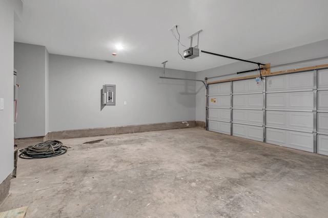 garage with electric panel and a garage door opener