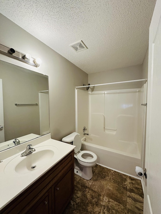 full bathroom with toilet, shower / bathing tub combination, a textured ceiling, and vanity