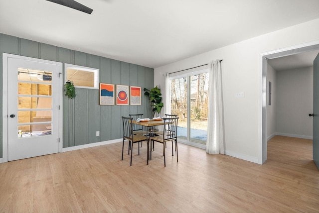 dining area featuring light wood-type flooring and ceiling fan