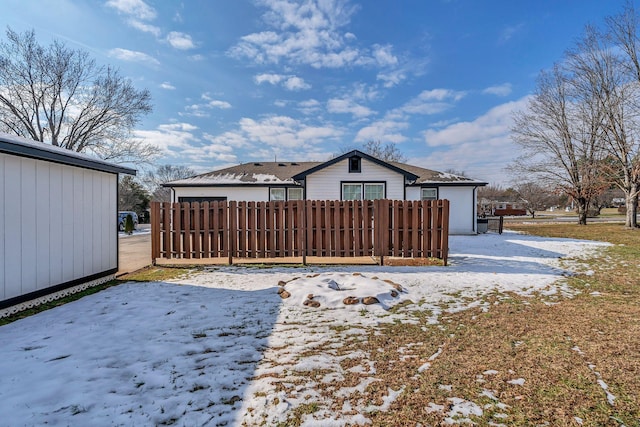 view of snow covered house