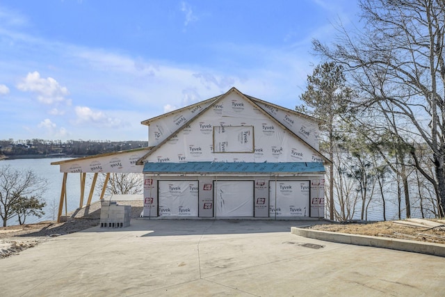 view of front of house featuring a water view