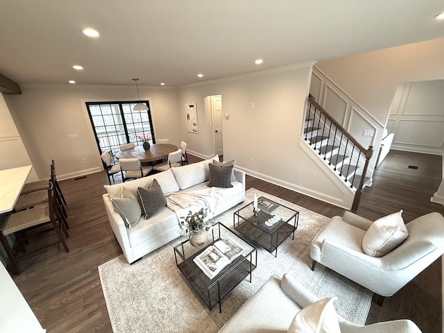 living room with crown molding and dark hardwood / wood-style flooring