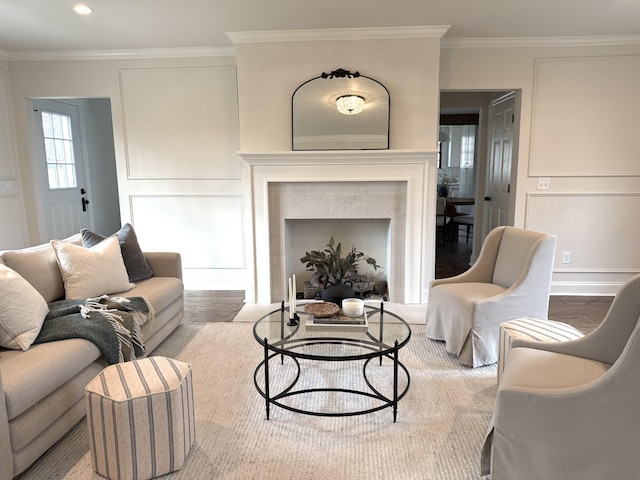 living room featuring hardwood / wood-style flooring and ornamental molding