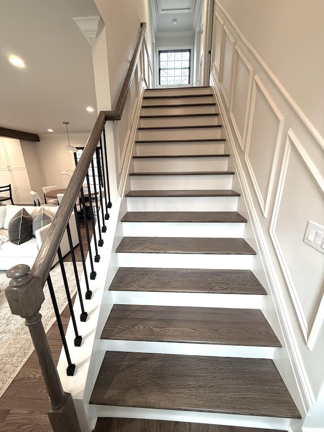 stairs with hardwood / wood-style floors