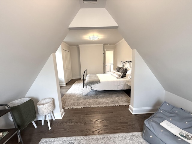 bedroom with hardwood / wood-style flooring and crown molding