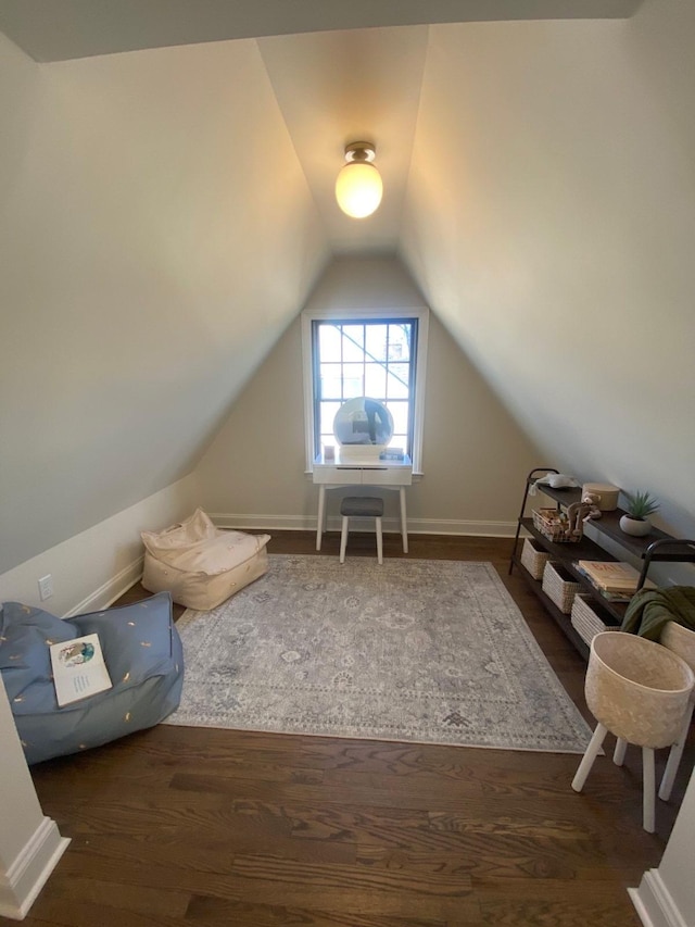 bonus room featuring lofted ceiling and dark hardwood / wood-style floors