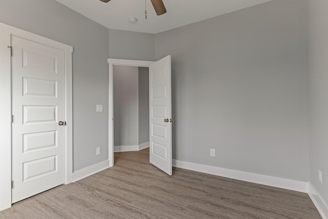 unfurnished bedroom featuring ceiling fan and light hardwood / wood-style flooring