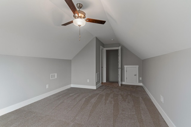 additional living space with ceiling fan, lofted ceiling, and carpet flooring