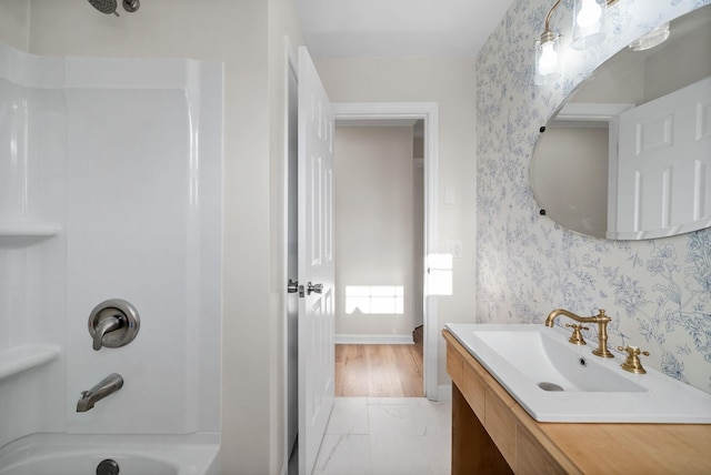 bathroom featuring tub / shower combination and vanity