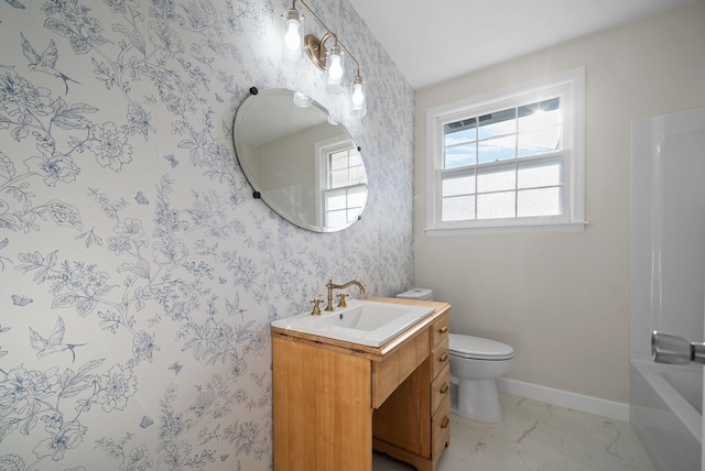 bathroom featuring toilet and vanity