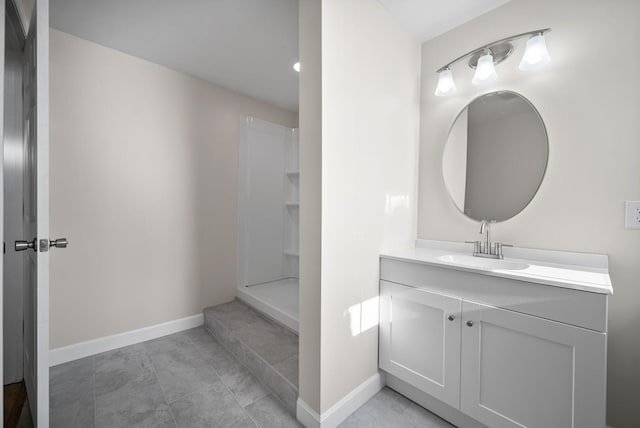 bathroom with vanity, tile patterned flooring, and walk in shower