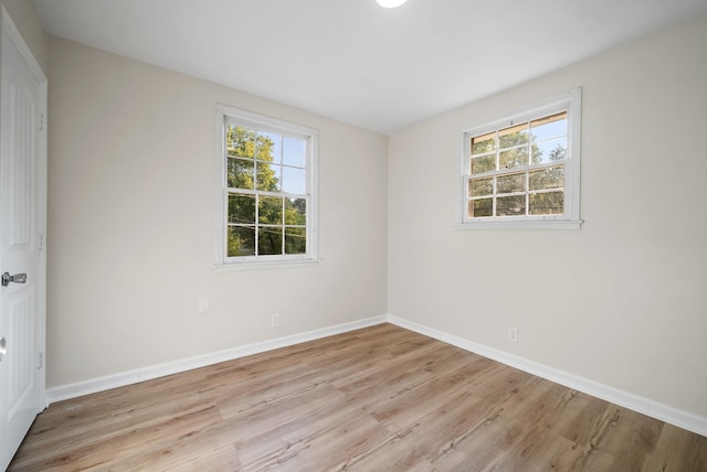 empty room with light hardwood / wood-style floors