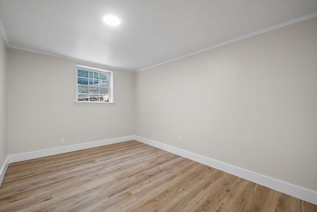 unfurnished room with ornamental molding and light hardwood / wood-style floors