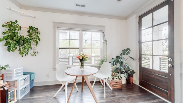 dining room with dark hardwood / wood-style flooring