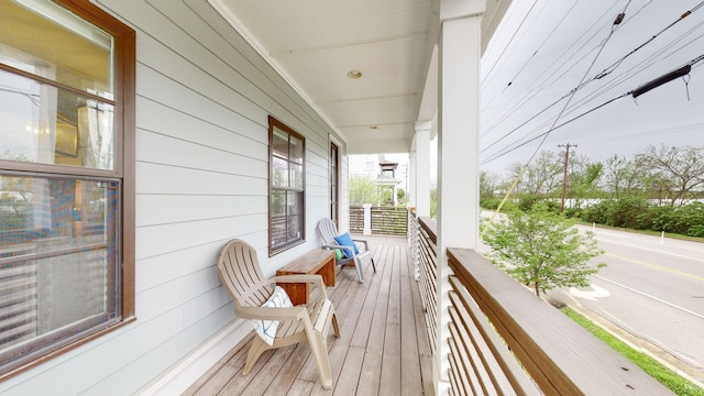 wooden deck featuring covered porch