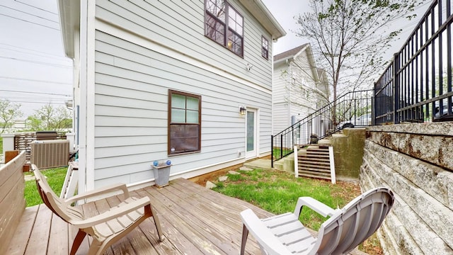 wooden deck with central air condition unit