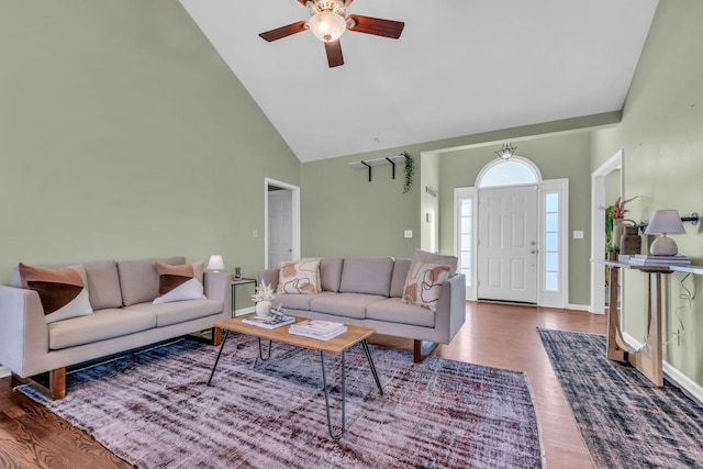 living room with high vaulted ceiling, ceiling fan, and dark hardwood / wood-style flooring