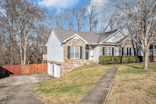 view of front of home featuring a front yard and a garage